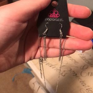 a leaf pendant necklace and chandelier earrings.